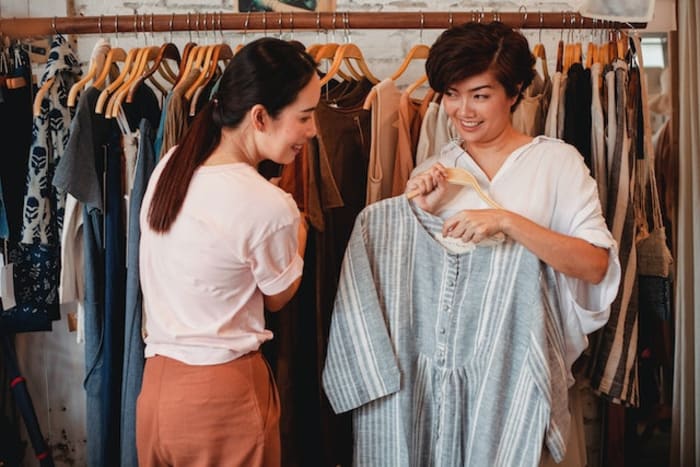 two girls checking out a outfit